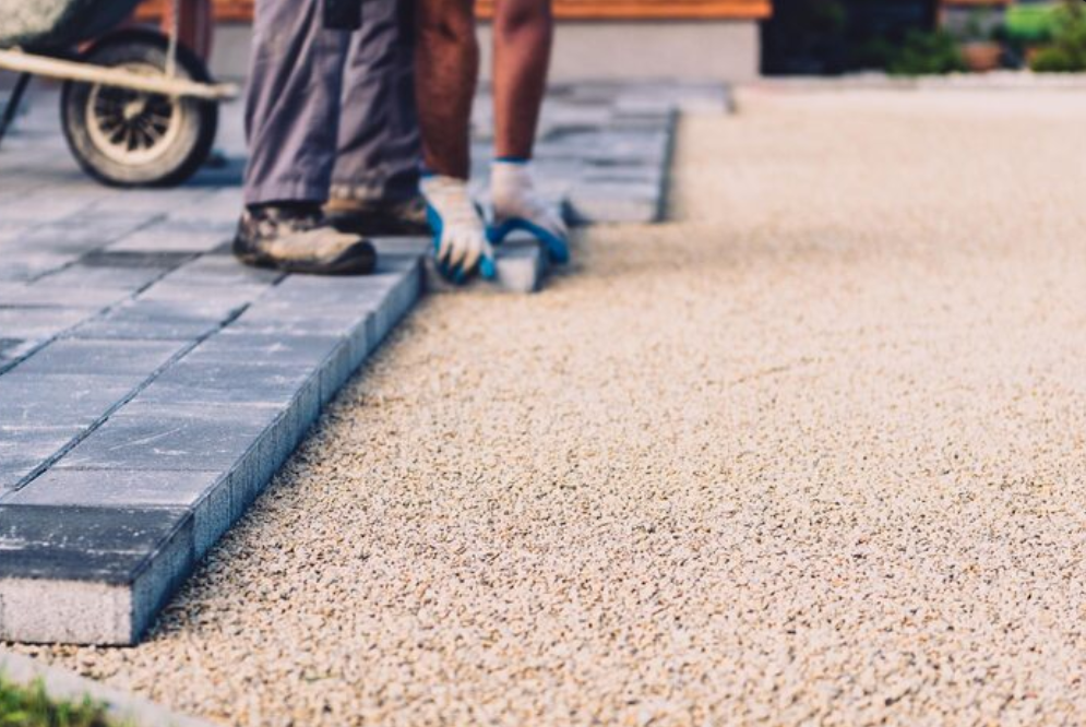 worker doing patio leveling